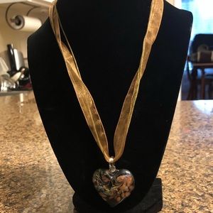 Glass heart necklace.